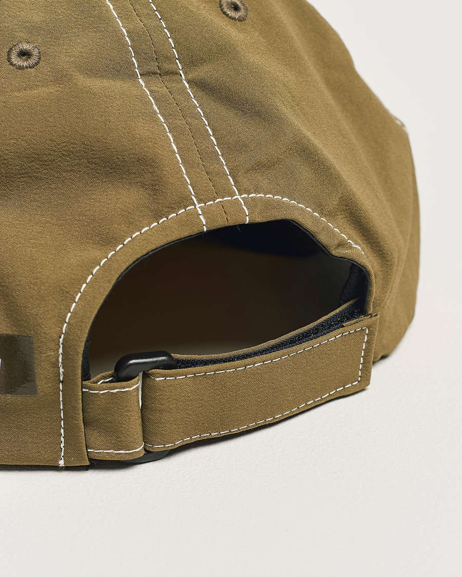 Herren | Satisfy PeaceShell Running Cap Oil Green | Satisfy | PeaceShell Running Cap Oil Green